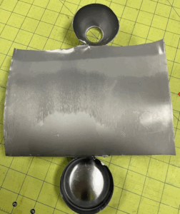 Bird Dog Leak Detector - A photo of an aerosol can that has been cut open for inspection, showing no internal corrosion after a failed pressure and submersion leak test.